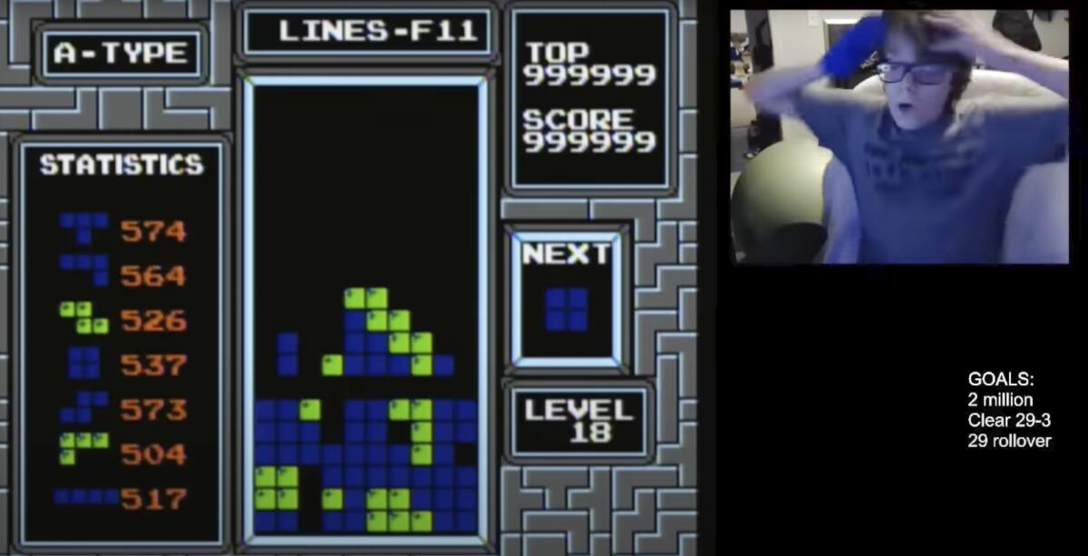 A screengrab shows a boy reacting after playing Tetris