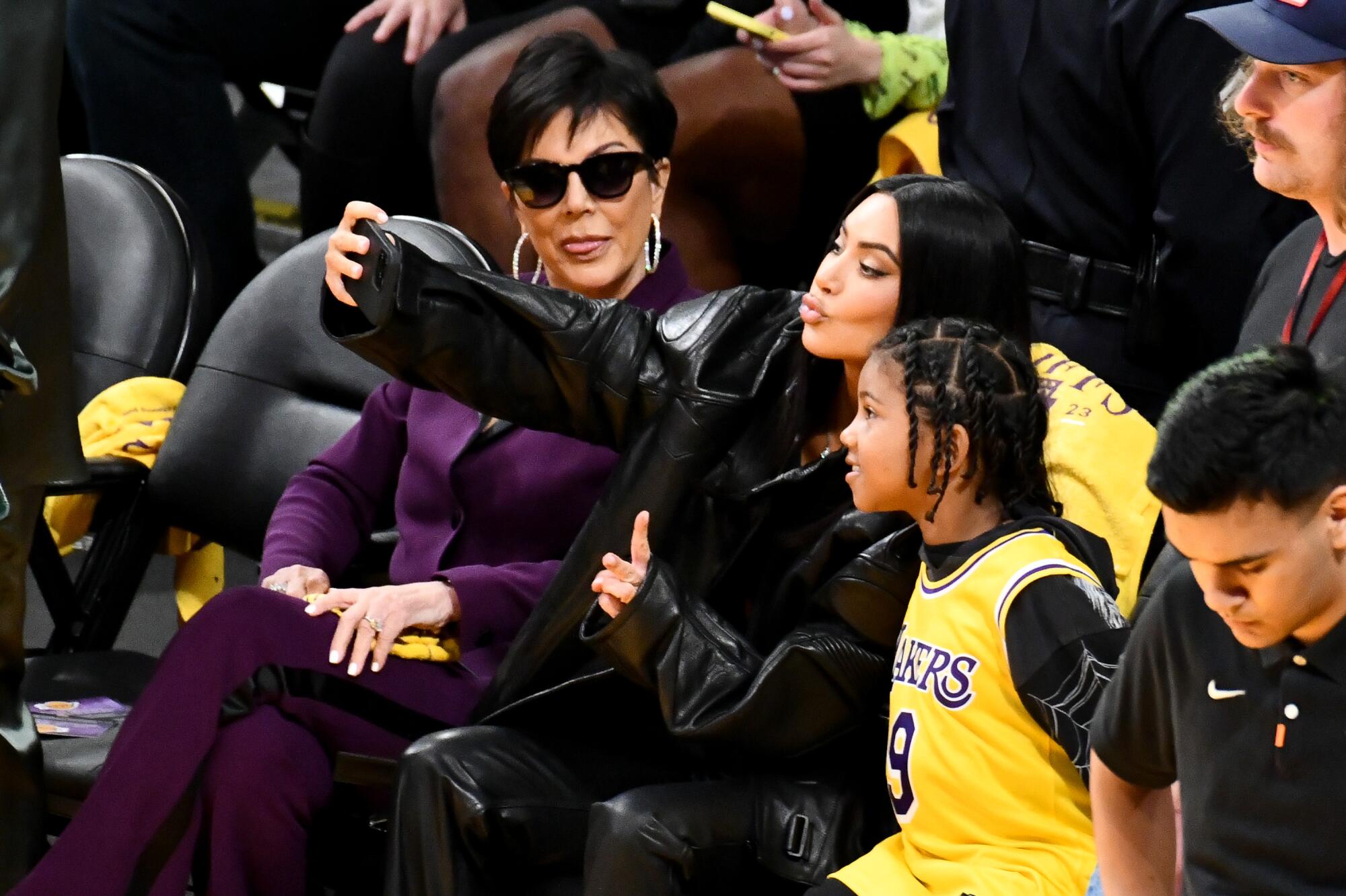 Kris Jenner watches Kim Kardashian takes a selfie with Saint West