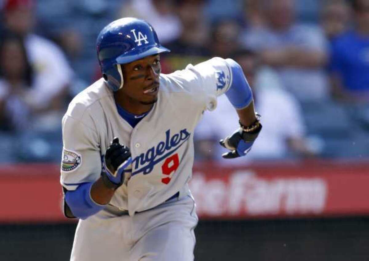 Dee Gordon singles during a Dodgers-Angels game.