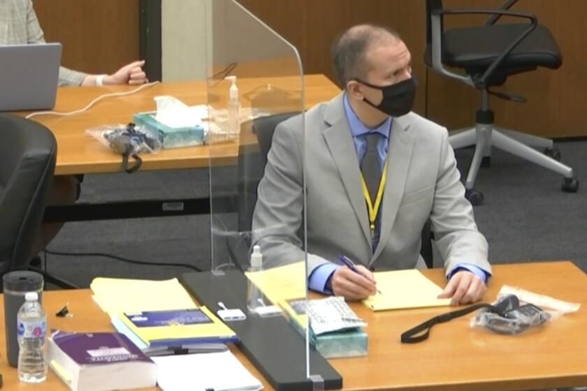 In this image from video, defendant and former Minneapolis police officer Derek Chauvin, right, listens as Hennepin County Judge Peter Cahill presides over pretrial motions before jury selection Tuesday, March 9, 2021 at the Hennepin County Courthouse in Minneapolis. Chauvin is charged in the May 25, 2020 death of George Floyd. (Court TV, via AP, Pool)