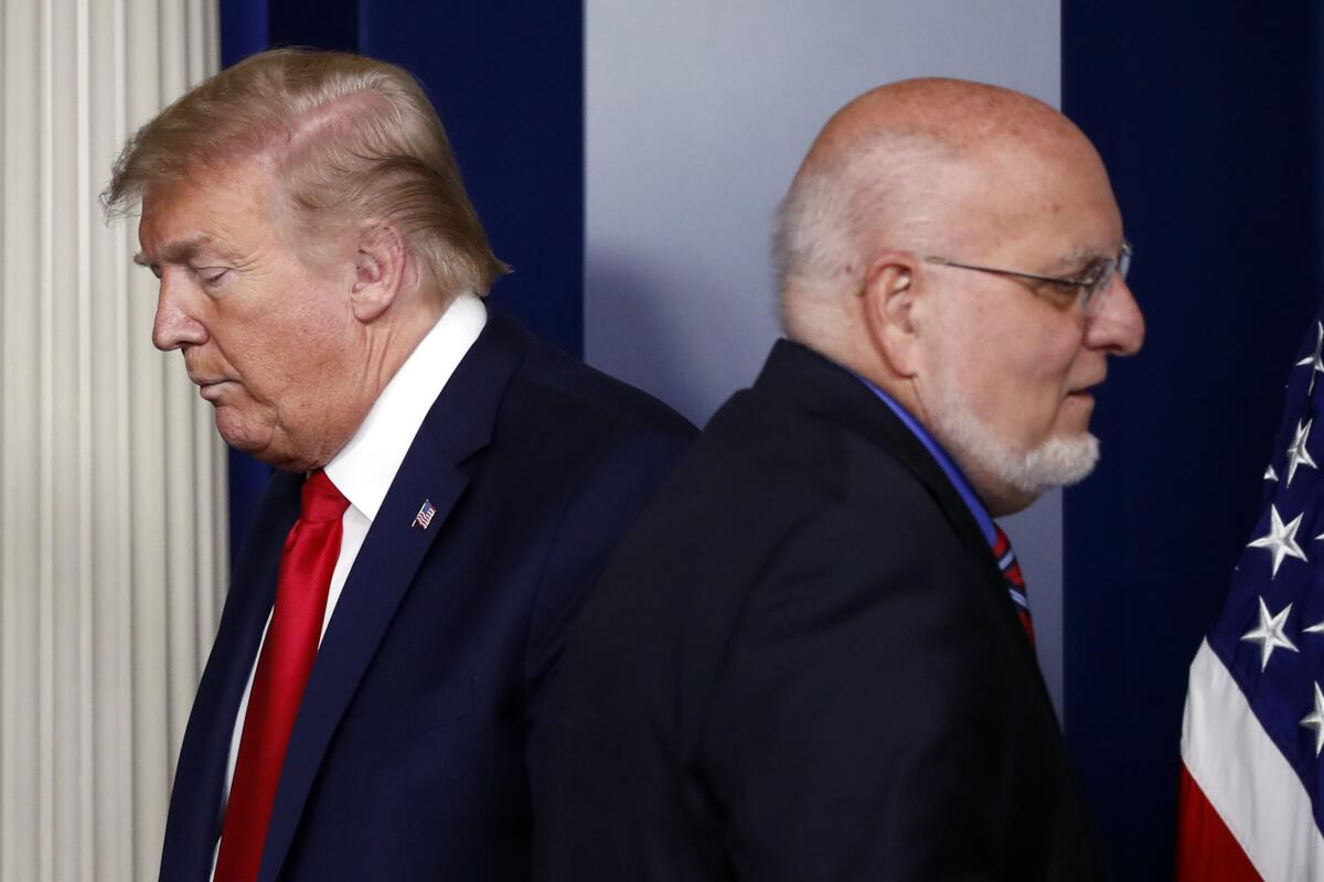 President Trump and Robert Redfield, director of the Centers for Disease Control and Prevention, at the White House in April.