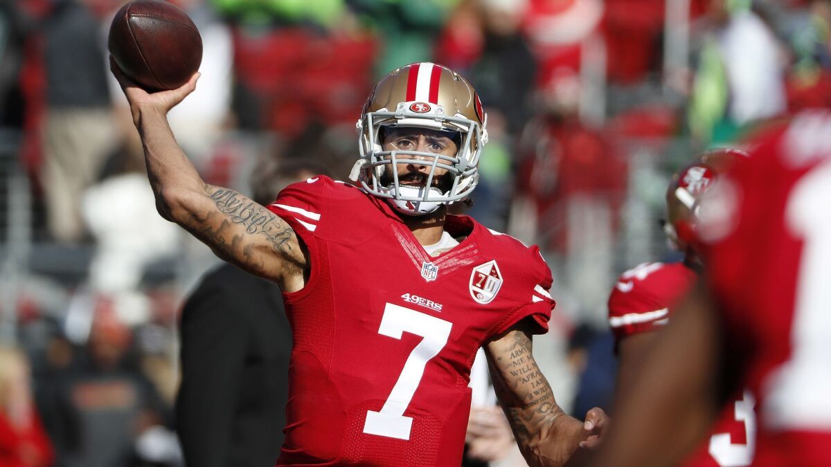 Colin Kaepernick warms up before a game between the San Francisco 49ers and Seattle Seahawks on Jan. 1, 2017 in Santa Clara. Washington Redskins coach Jay Gruden says the team "talked about and discussed" bringing in Kaepernick for a tryout.