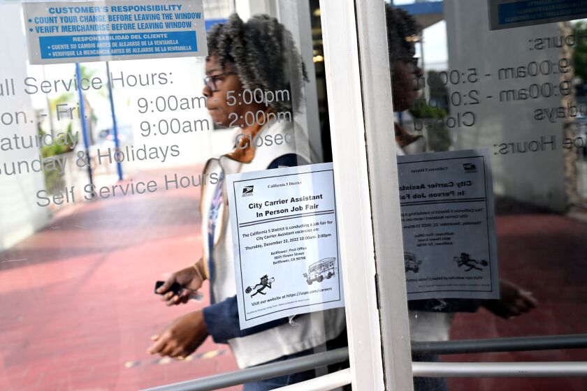 Bellflower, California December 22, 2022-A sign for a job fair hangs on the door in Bellflower Thursday in hopes of finding employment as the USPS is hiring twenty thousand new postal workers. (Wally Skalij/Los Angeles Times)
