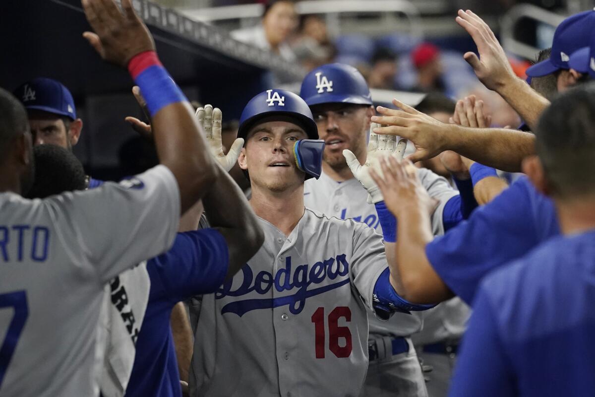 Dodgers catcher Will Smith celebrates with teammates after hitting a home run against the Miami Marlins on Monday.