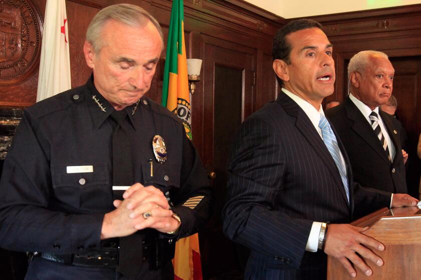 William J. Bratton, left, formally announced his resignation at a press conference at Los Angeles in August 2009 with Mayor Antonio Villaraigosa and police commission vice president John Mack.
