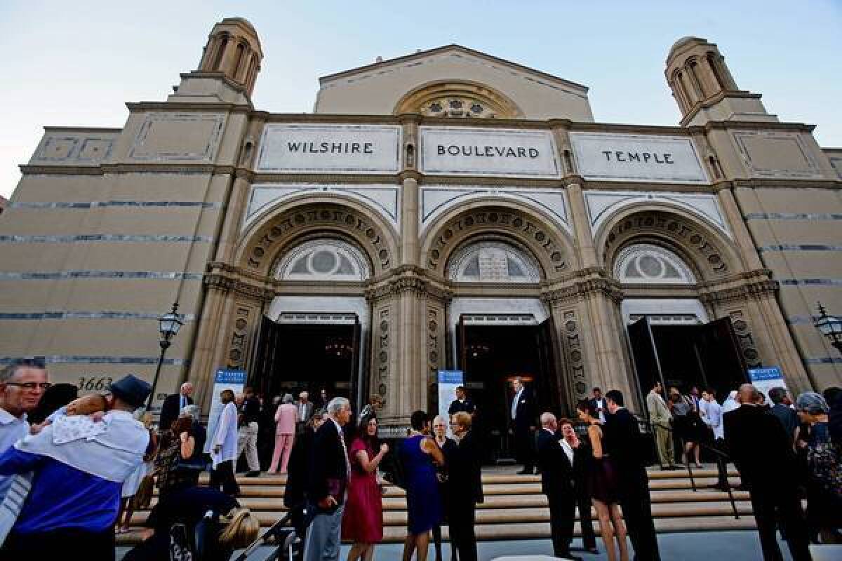 Congregants talk after Rosh Hashana services at the Wilshire Boulevard Temple.