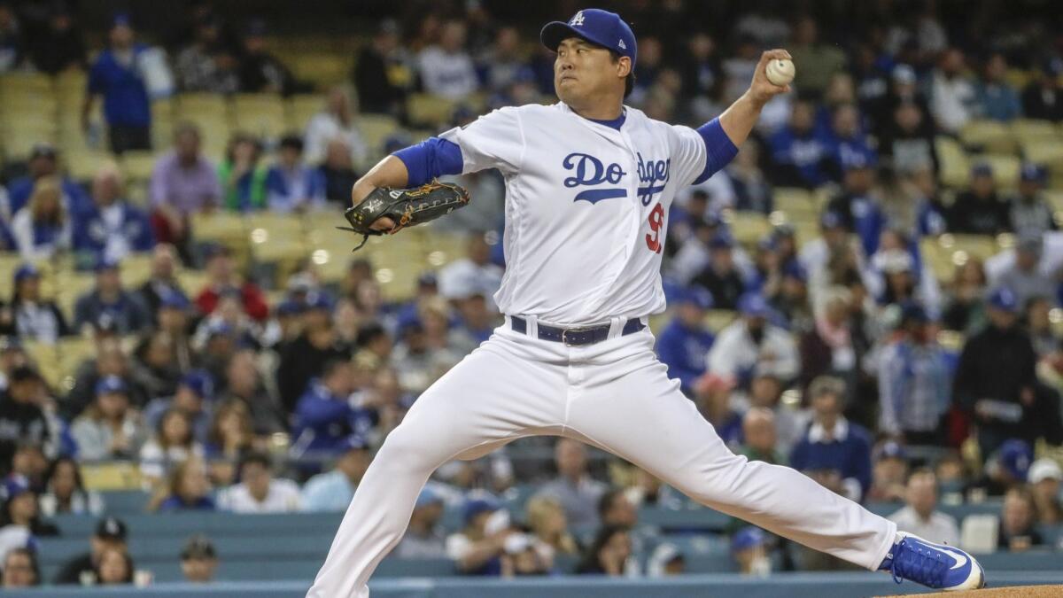 Dodgers starting pitcher Hyun-Jin Ryu pitches against the Atlanta Braves in the first inning on Tuesday at Dodger Stadium.