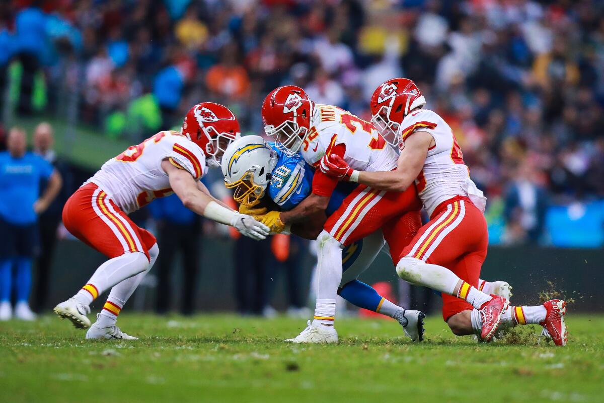 Chiefs safety Tyrann Mathieu tackles Chargers running back Austin Ekeler during the second half of a game Nov. 18 at Estadio Azteca.