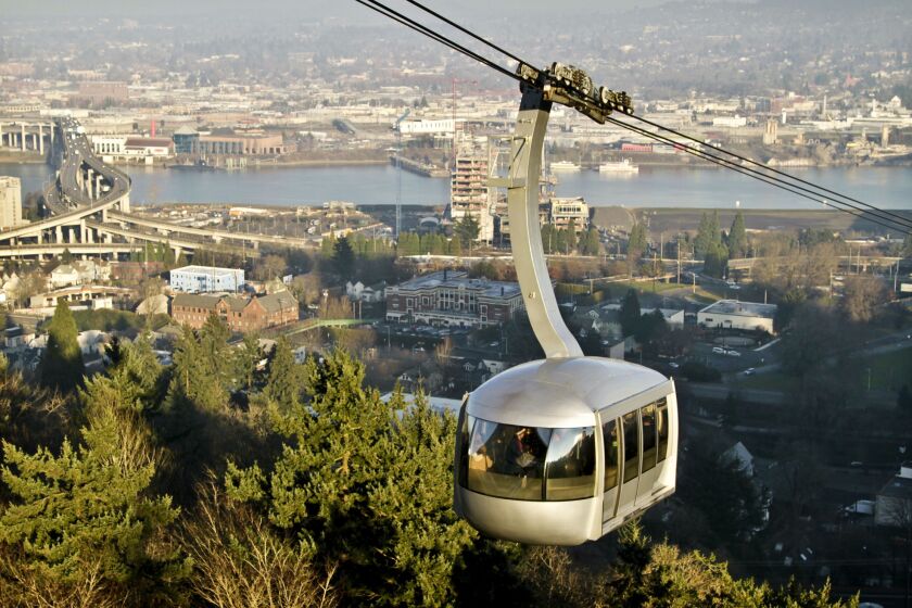 The Portland Aerial Tram, with the Willamette River and Ross Island Bridge in the background, on Jan. 19, 2013.