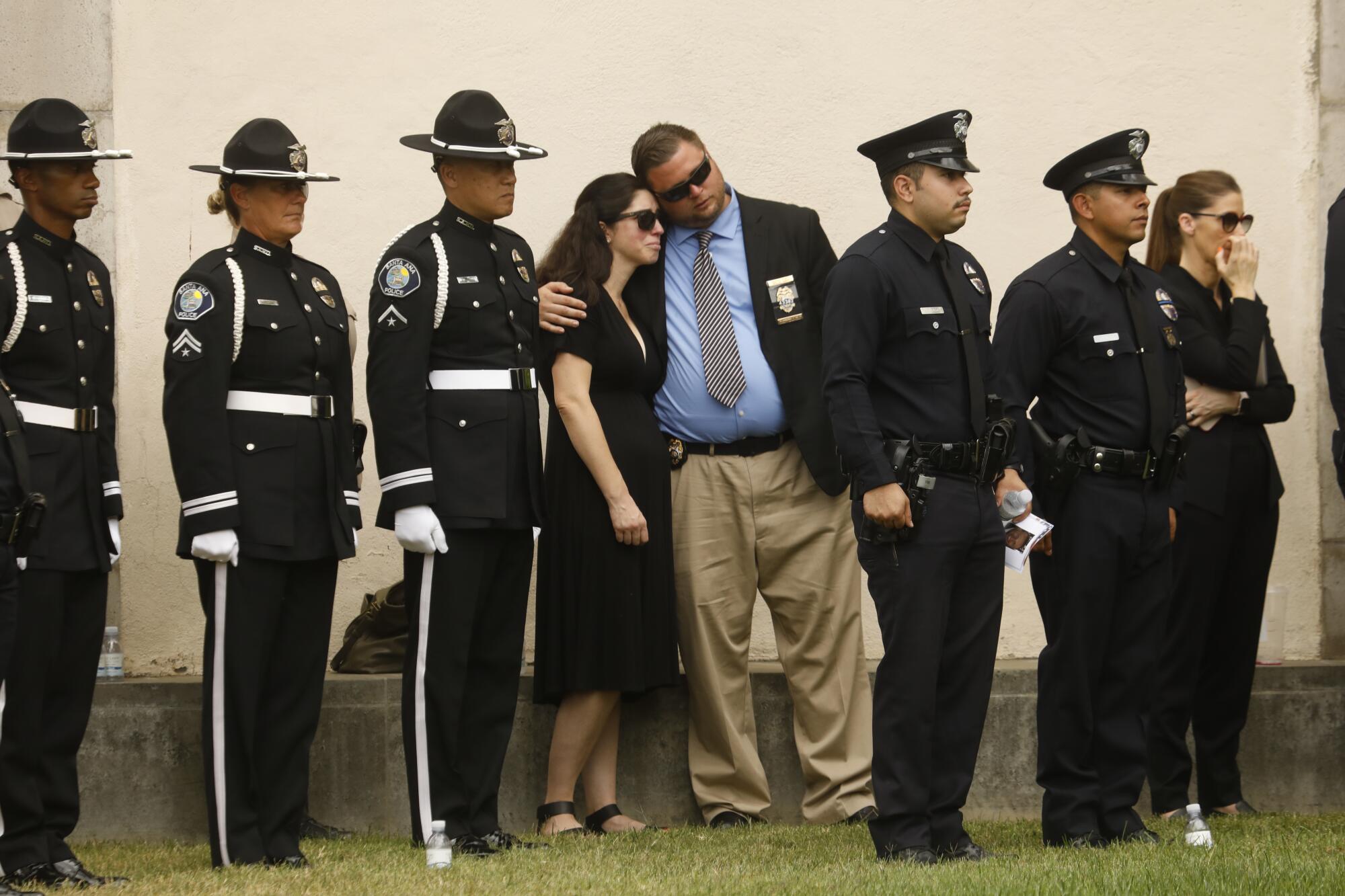 Family, friends, city officials and fellow officers pay respects