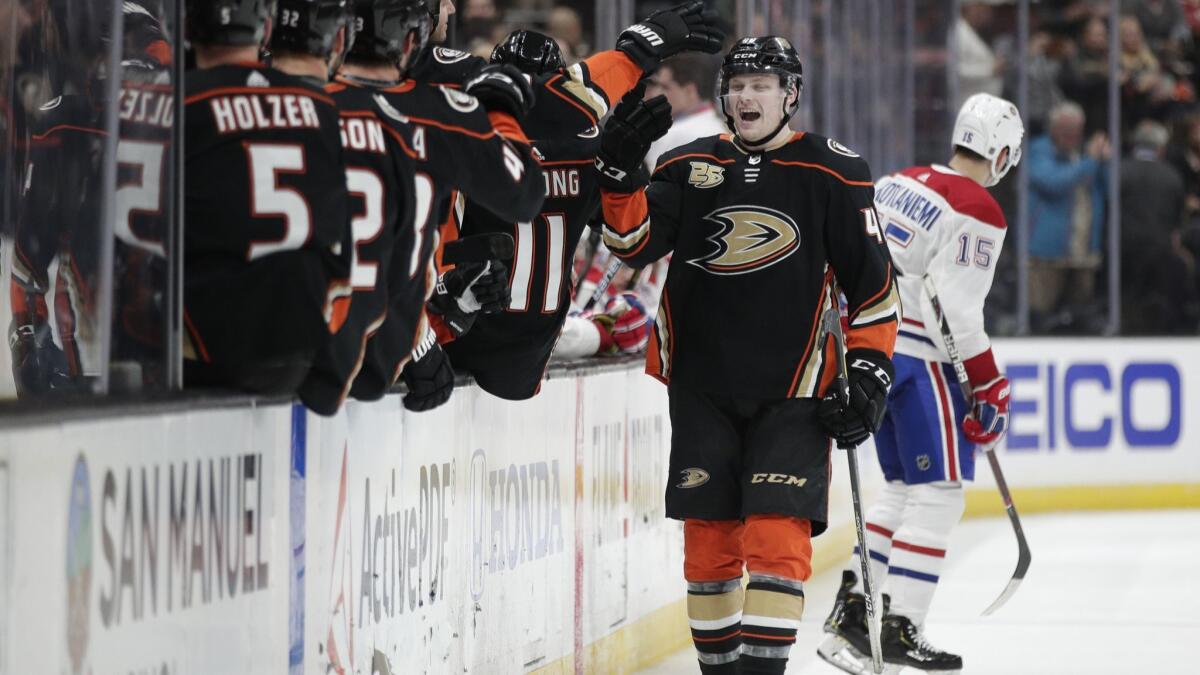 Ducks' Max Jones is congratulated by teammates after scoring a goal against the Montreal Canadiens during the third period on Friday at the Honda Center.