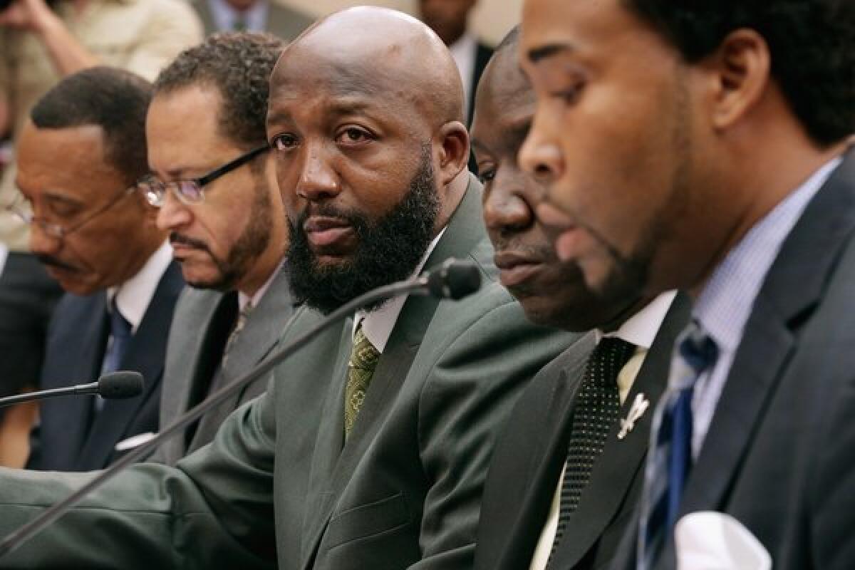 From left, former NAACP President Kweisi Mfume; Georgetown University Professor Michael Eric Dyson; Trayvon Martin's father, Tracy Martin; Martin's lawyer Benjamin Crump; and David Johns, executive director of the White House Initiative on Educational Excellence for African Americans; appear at a hearing on Capitol Hill.