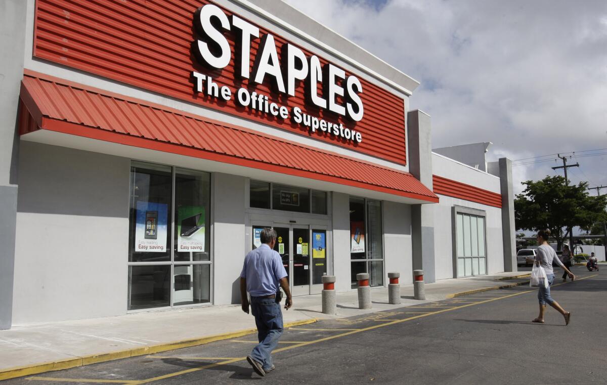 Activist investment firm Starboard Value LP called for a merger between office supply companies Staples Inc. and Office Depot Inc. in a letter Tuesday. A Staples office supply store in Miami in 2011.