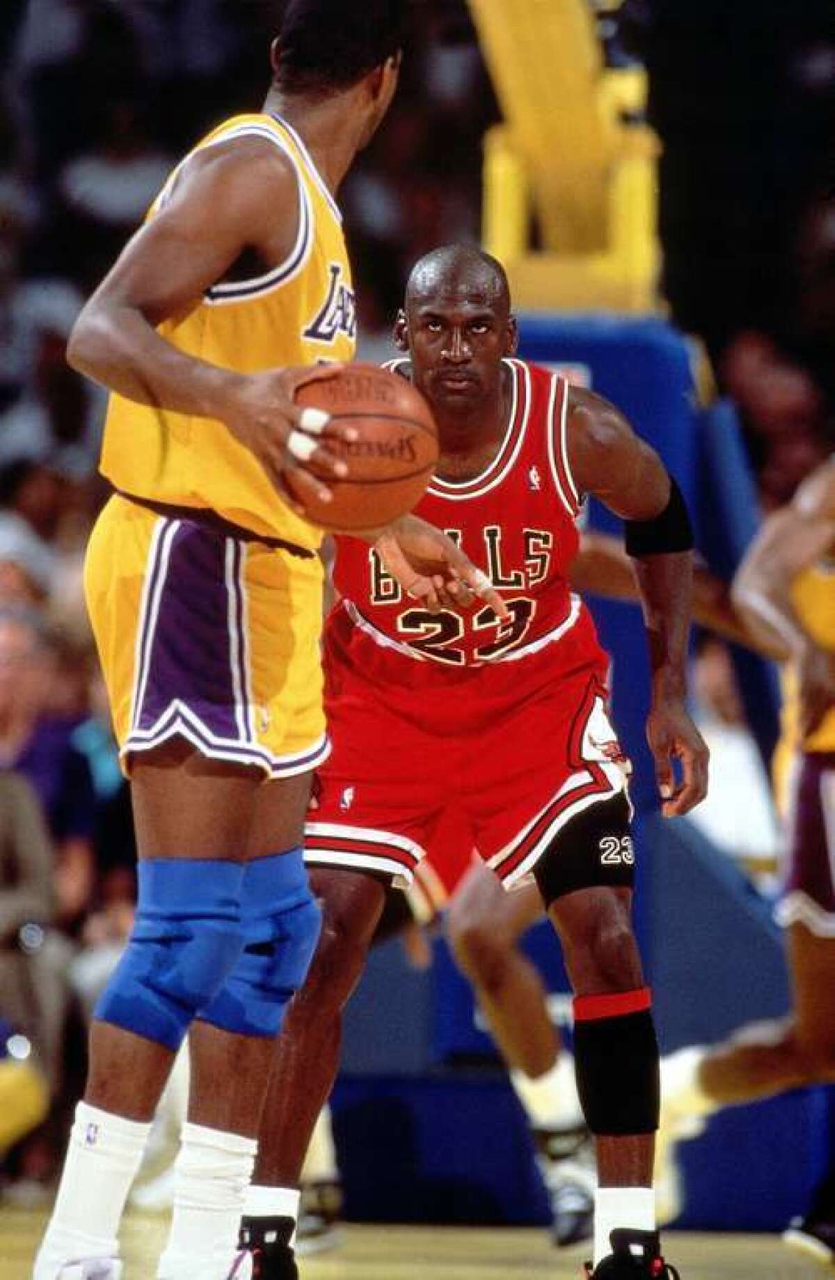 Michael Jordan defends against Magic Johnson during the 1991 NBA Finals at the Great Western Forum.