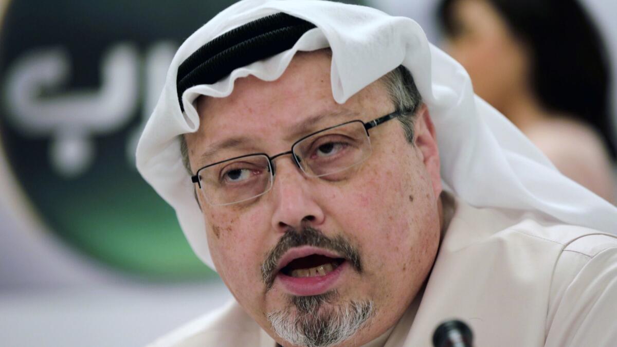 Saudi journalist Jamal Khashoggi speaks during a Dec. 15, 2014, news conference in Manama, Bahrain.