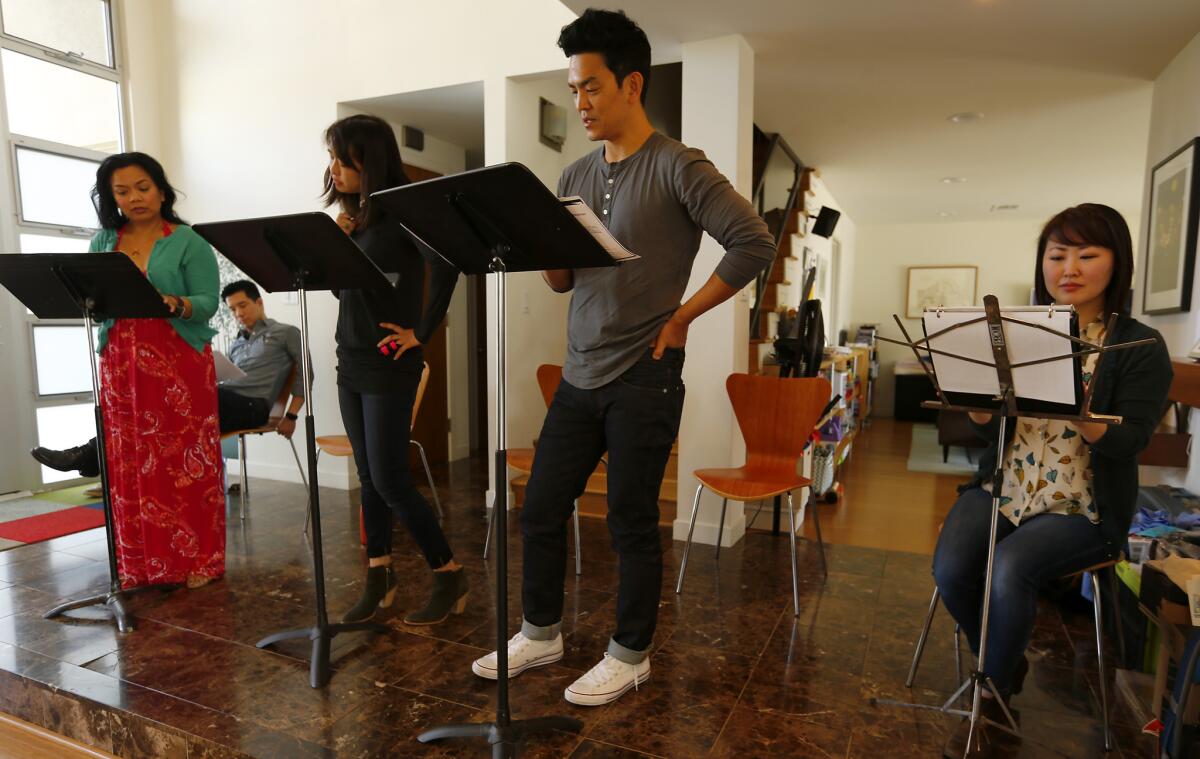 Actor John Cho, center, rehearses a scene with actors for Artists at Play, an Asian American theater group.