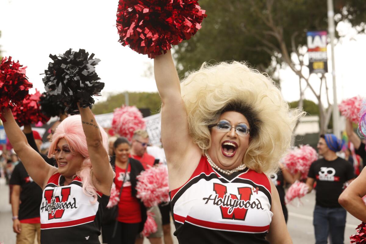 West Hollywood Cheerleader Nicklaus Fox marches down Santa Monica Blvd during the Gay Pride parade in West Hollywood.