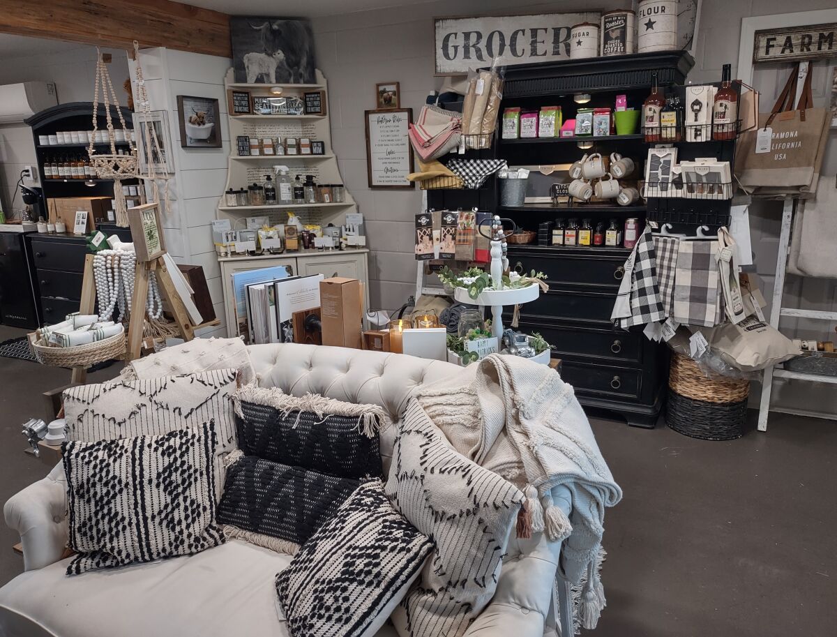 Home décor displays are artfully arranged in Rustic Interiors’ cozy shop at 603 Main St, Suite 9.