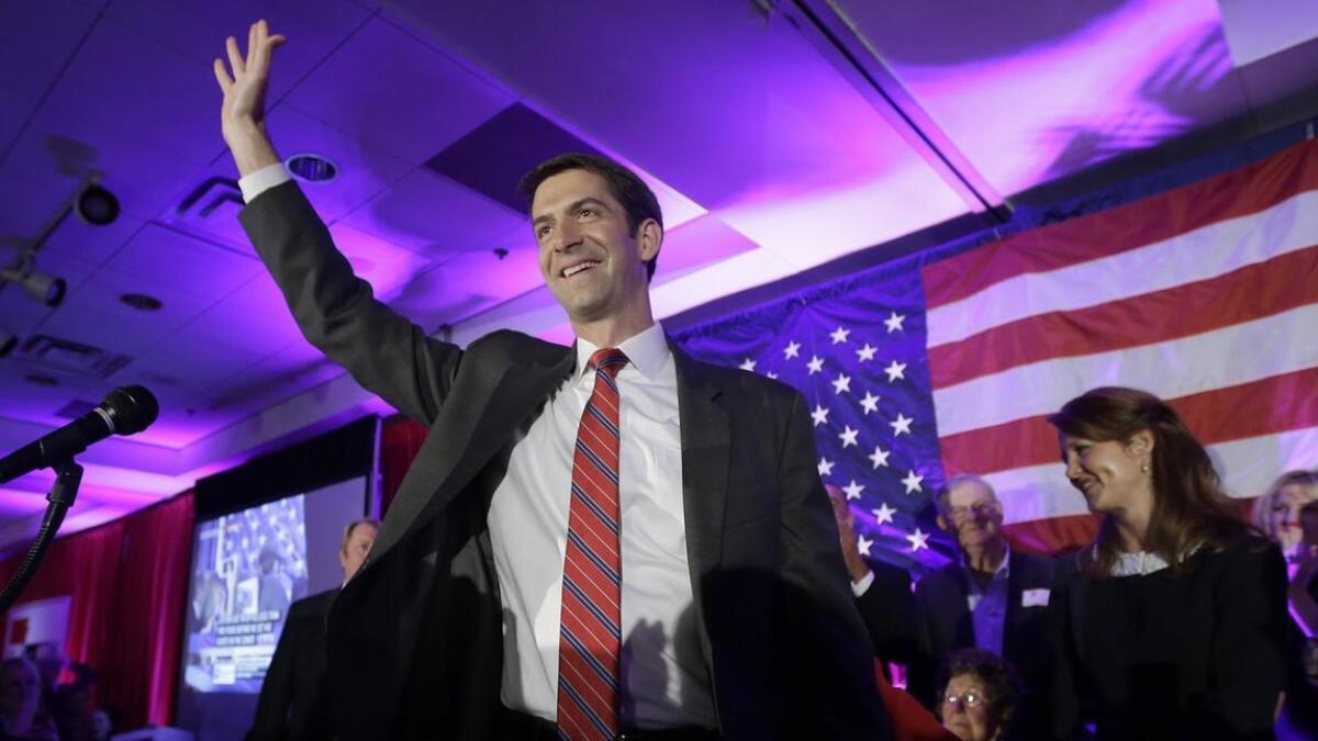 Rep. Tom Cotton (R-Ark.) waves at his election watch party in North Little Rock, Ark., after defeating Sen. Mark Pryor.