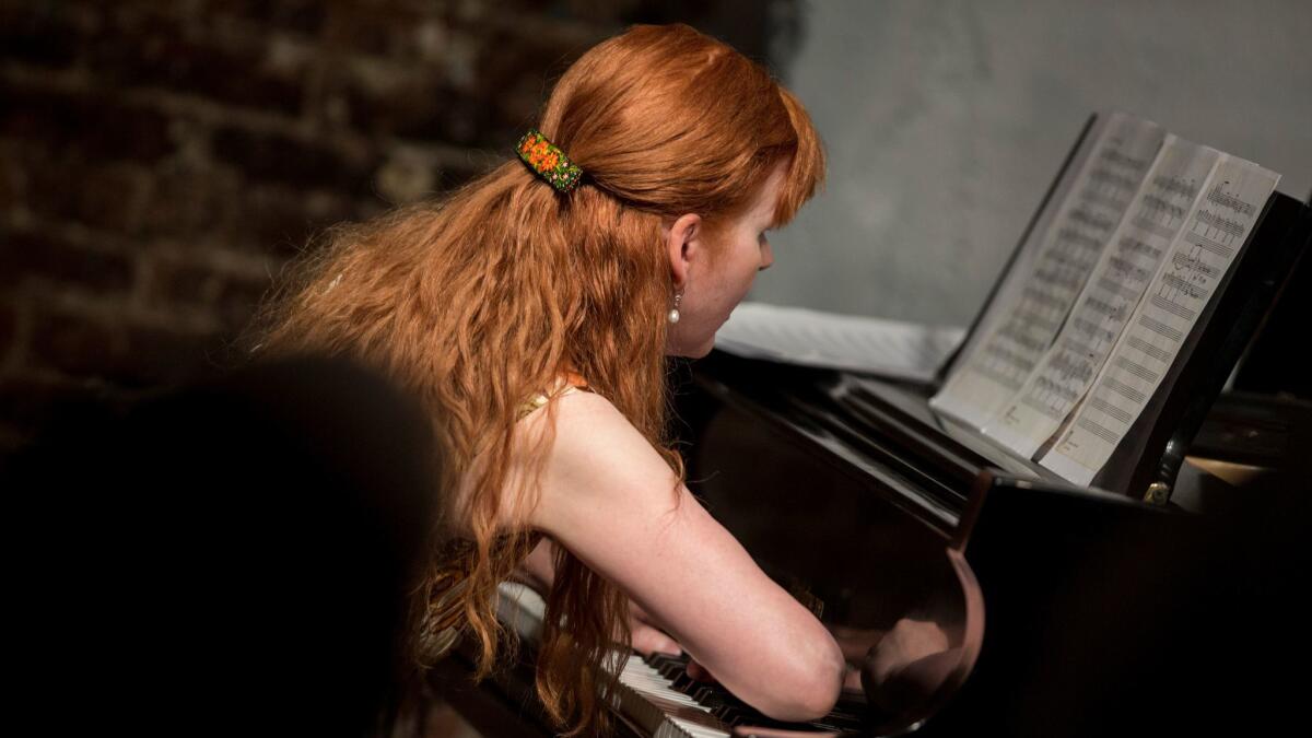 Pianist Sarah Cahill uses her forearm, part of the technique required to play Lou Harrison's piano music in a tribute to the composer at Monk Space on Tuesday night.