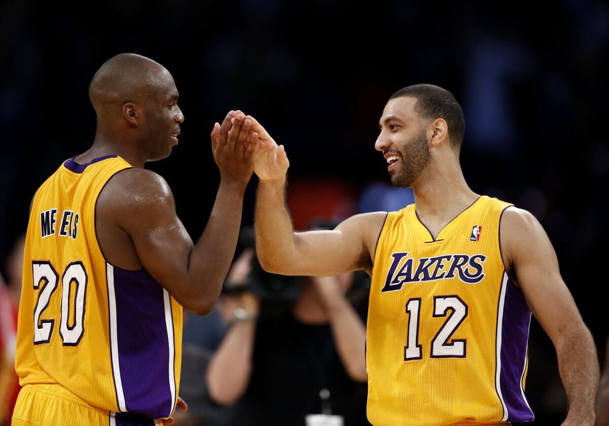 Jodie Meeks, left, and Kendall Marshall celebrate the Lakers' lead against the Jazz in the second half.