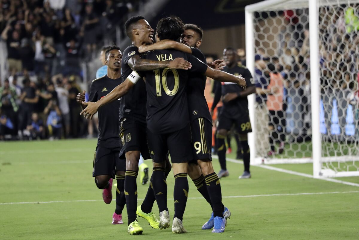 Adrien Perez scored his first MLS goal and Diego Rossi also connected to help Los Angeles FC tie Orlando City 2-2 on Saturday night.