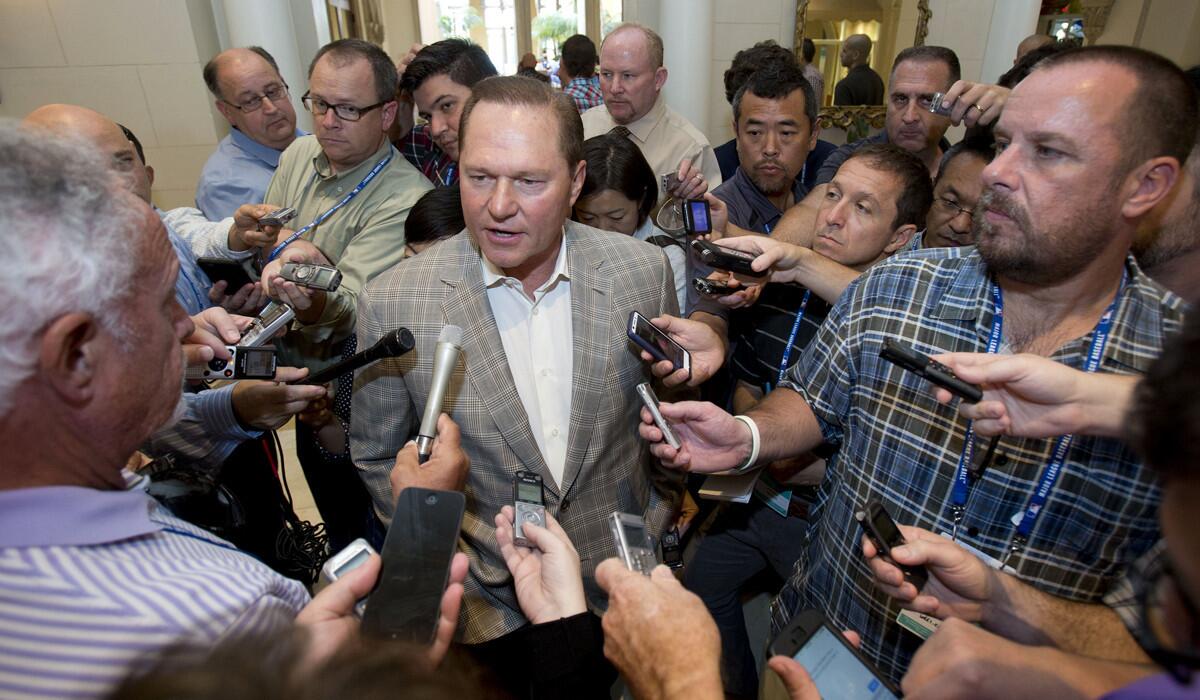 Sports agent Scott Boras speaks to reporters at the baseball general managers meetings on Nov. 11 in Boca Raton, Fla.