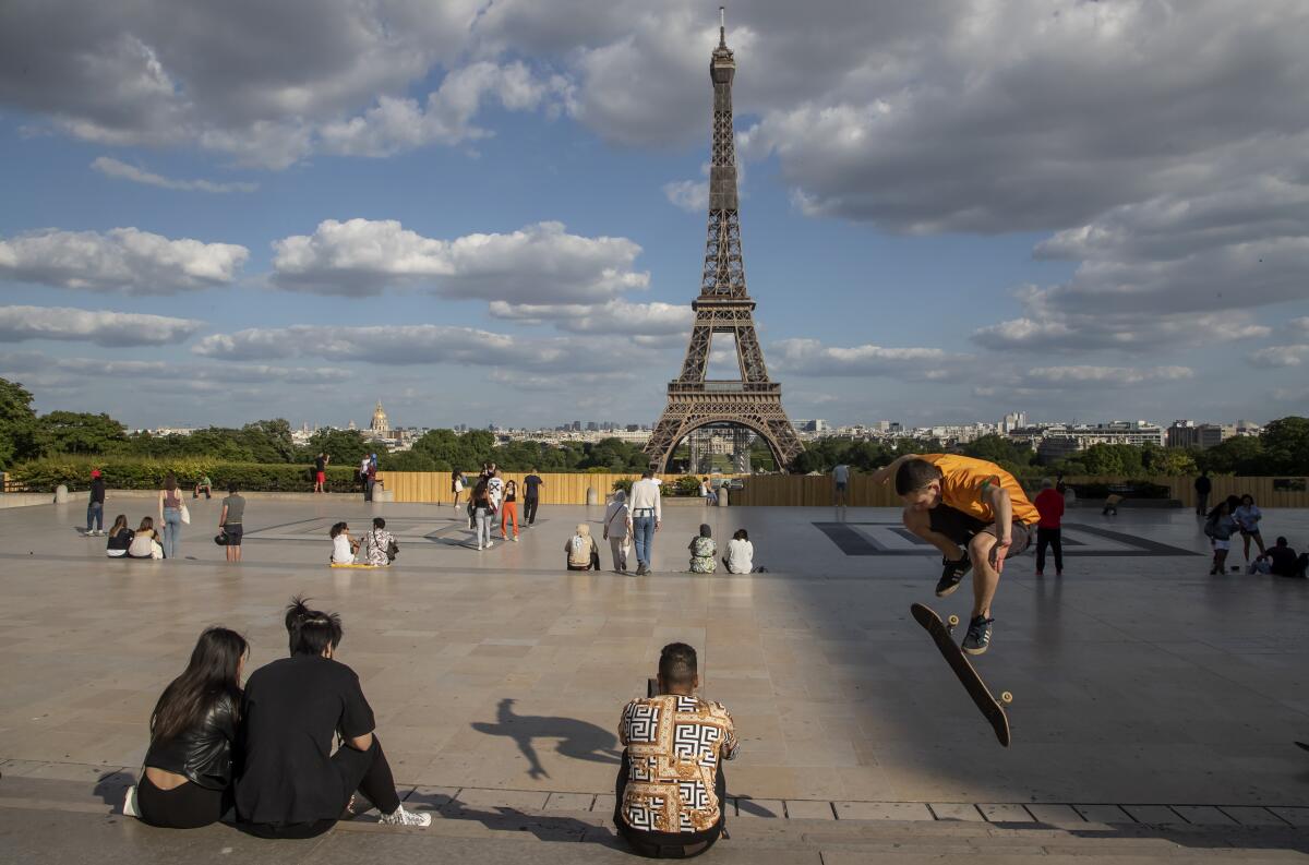 Eiffel Tower rises above Trocadero Square in Paris
