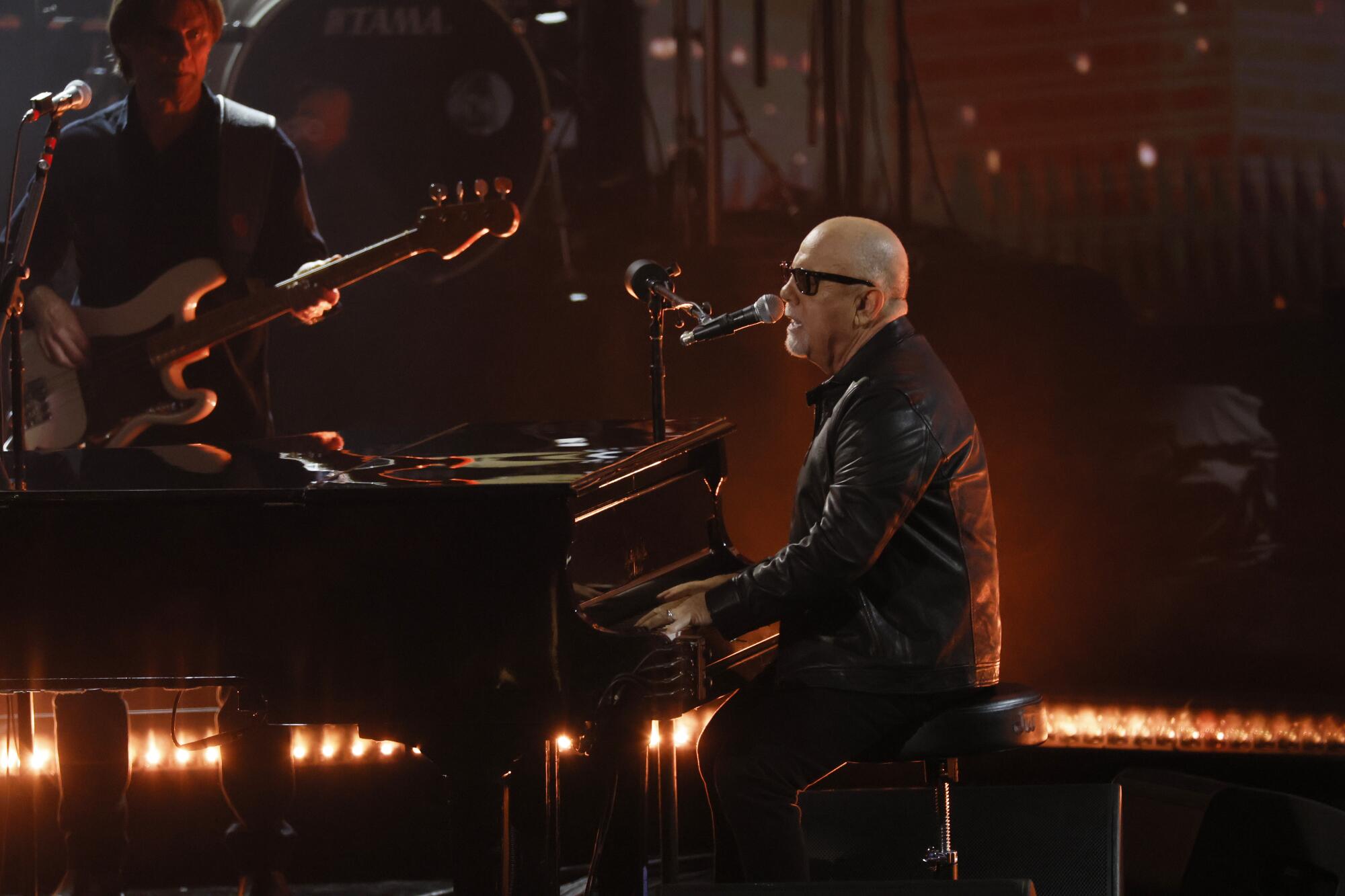Billy Joel plays the piano and sings during the 66th Grammy Awards at Crypto.com Arena