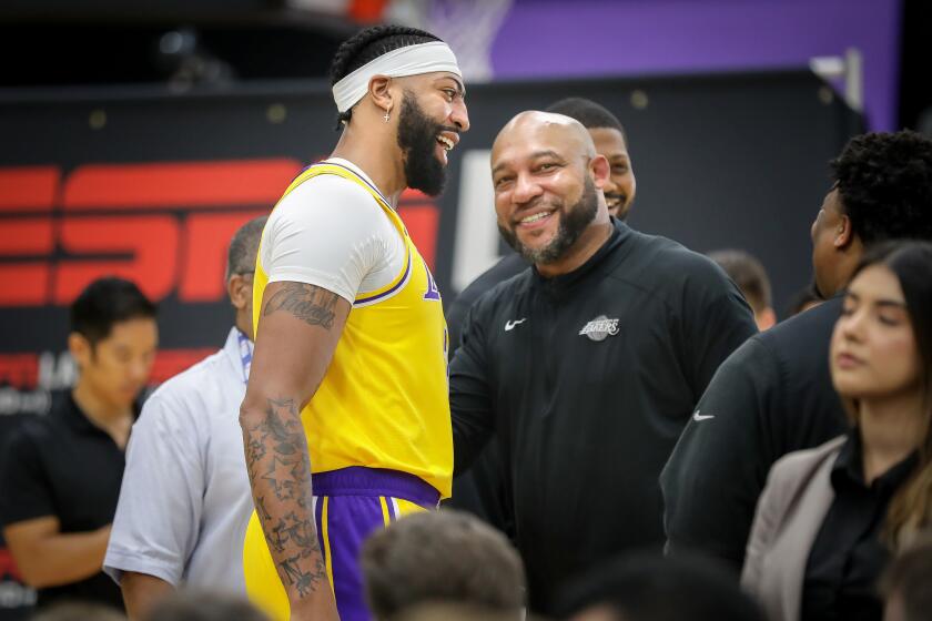 EL SEGUNDO, CA - SEPTEMBER 26, 2022: Anthony Davis and head coach Darvin Ham chat during Lakers Media Day.