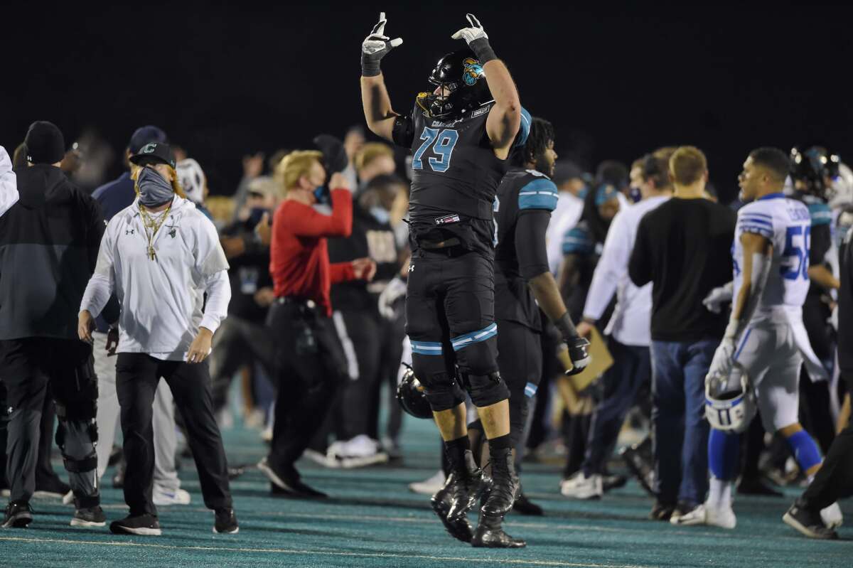 Coastal Carolina's Steven Bedosky celebrates after Saturday's 22-17 victory over Brigham Young.