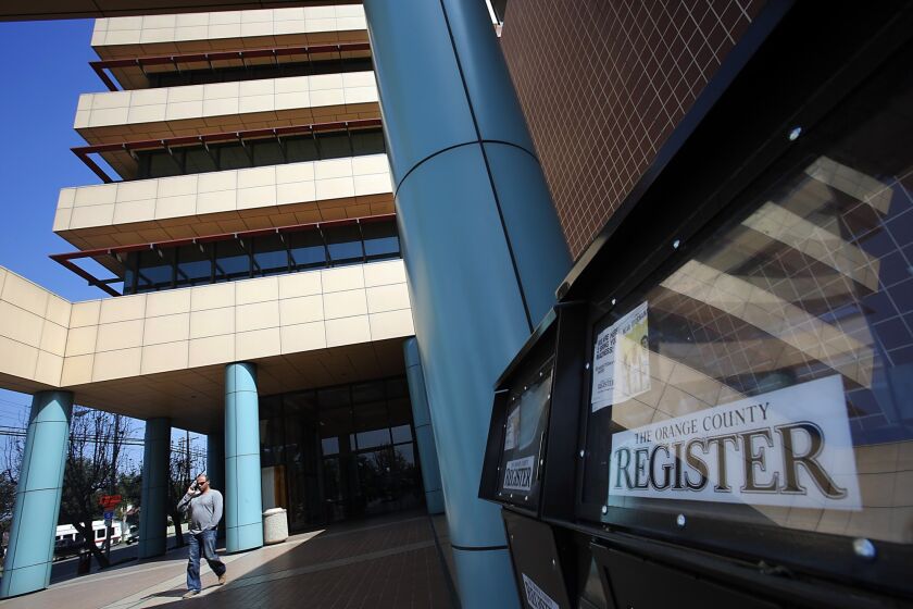 Freedom Communications Inc. is showing signs of financial distress. The parent company of the Orange County Register, whose headquarters are shown, is expected to announce layoffs Monday.
