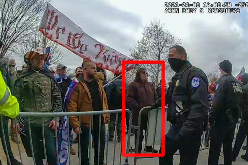 In this image from U.S. Capitol Police video, released and annotated by the Justice Department in the sentencing memorandum, Patrick McCaughey III,, appears on police body-worn camera footage at the U.S. Capitol on Jan. 6, 2021, in Washington. McCaughey who used a stolen riot shield to crush a police officer in a doorframe during the U.S. Capitol insurrection was sentenced on April 14, 2023, to more than seven years in prison for his role in one of the most violent episodes of the Jan. 6 attack.(Justice Department via AP)