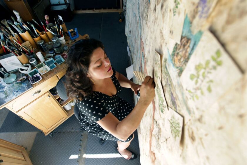 LOS ANGELES, CA., OCTOBER 1, 2018 --- In creating her large scale paintings, artist Sandy Rodriguez turns to the past, employing handmade papers crafted from bark and hand-ground pigments made from cochineal. She uses these to create works inspired by Mayan and colonial codices, but that are contemporary in nature  touching on politics, immigration, deportation and, now, child separation. The artist will be the subject of exhibitions at the Municipal Art Gallery and the Riverside Art Museum in October and November. (Kirk McKoy / Los Angeles Times)