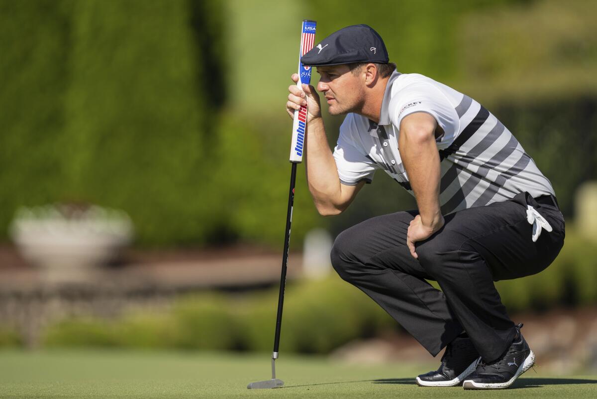Bryson DeChambeau lines up his putt on the seventh hole during the third round of the Wells Fargo Championship golf tournament at Quail Hollow, Saturday, May 8, 2021, in Charlotte, N.C. (AP Photo/Jacob Kupferman)