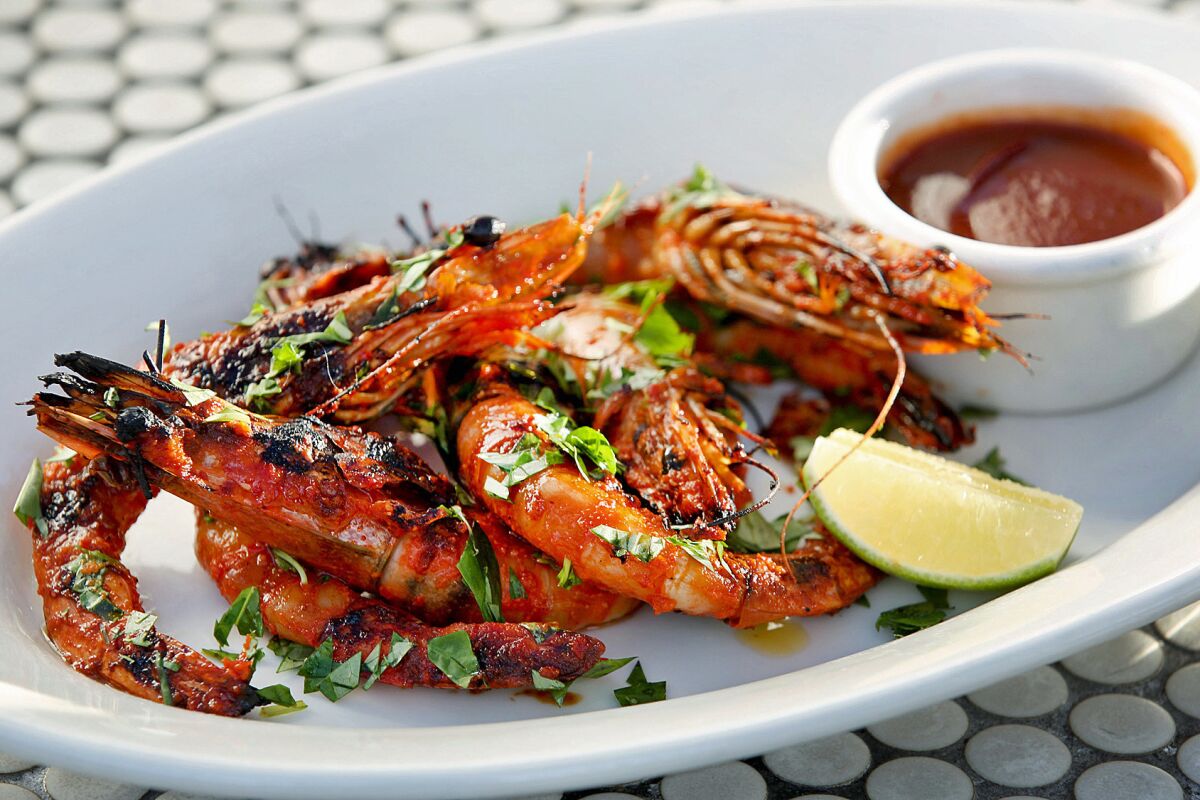 Vietnamese sunbathing prawns with Fresno chiles, garlic and Vietnamese hot sauce.