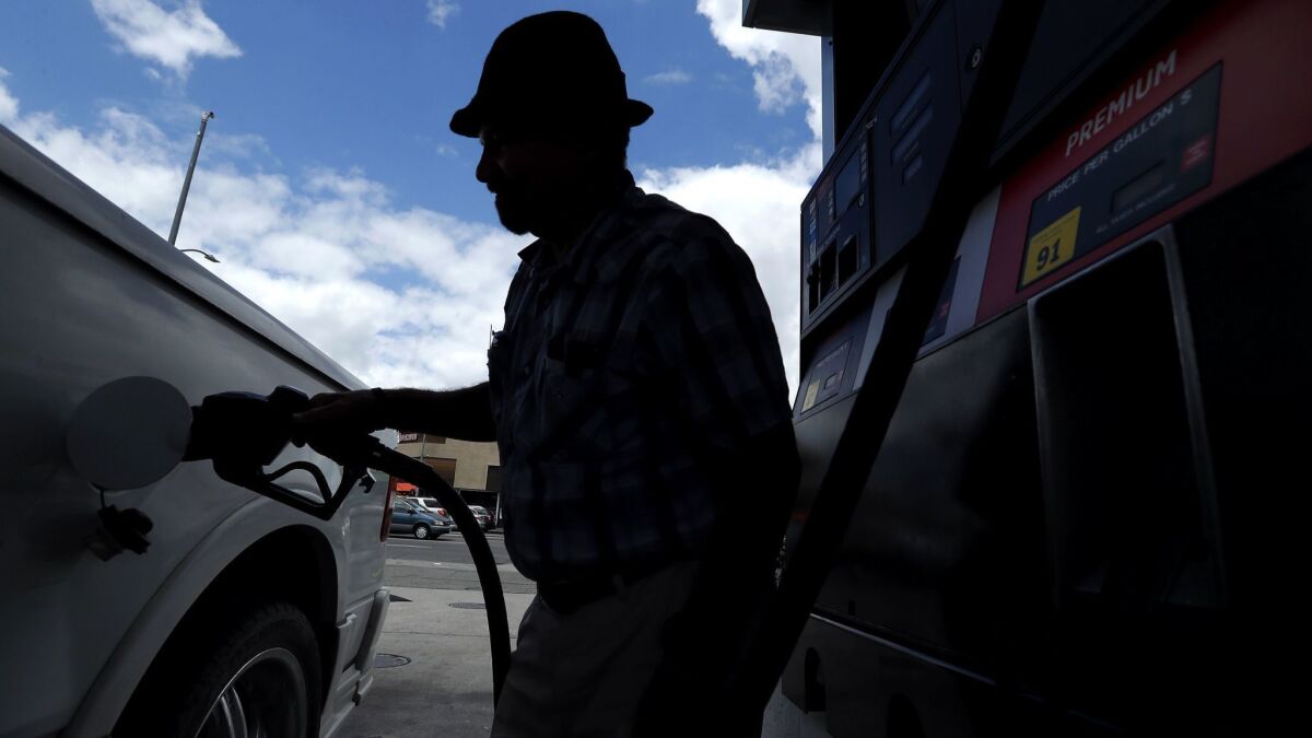 A man fills the tank on his truck at a gas station in Van Nuys, Calif. on May 25.