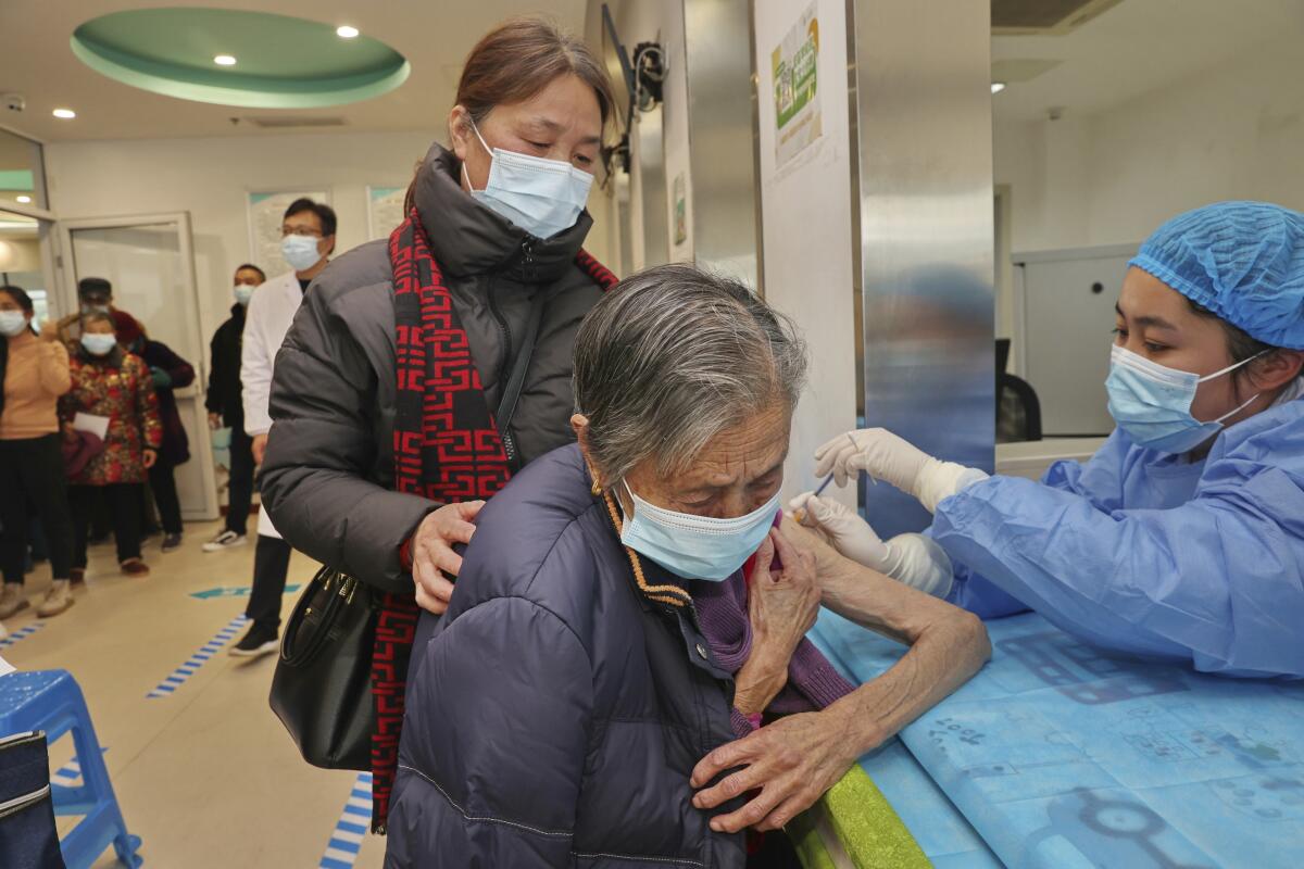 Woman receiving COVID shot in China