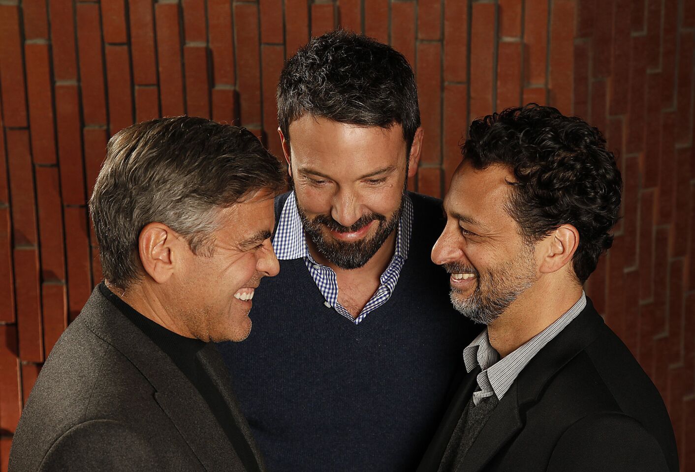 With Ben Affleck, center, and close freind Grant Heslov, Clooney held the producer's role in the political thriller "Argo." With Oscar nods for "Argo" in 2013, it made Clooney the only person in Academy Award history to be nominated across six categories.