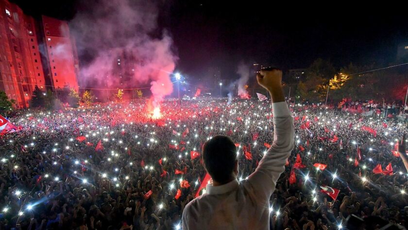 Candidate for mayor of Istanbul Ekrem Imamoglu (C) celebrating in front of thousands of supporters at Beylikduzu in Istanbul on June 23.