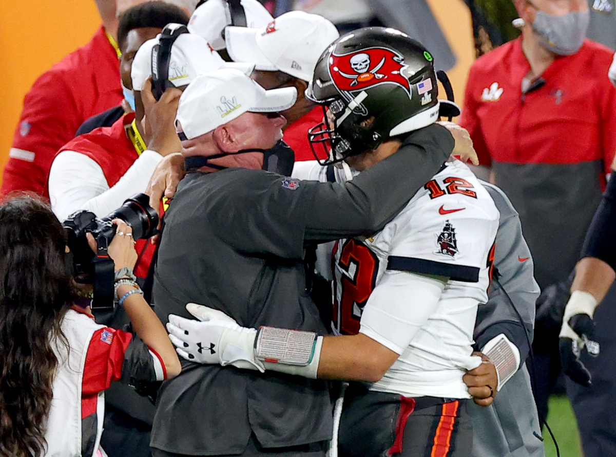 Tampa Bay Buccaneers coach Bruce Arians celebrates with Tom Brady after defeating the Kansas City Chiefs.