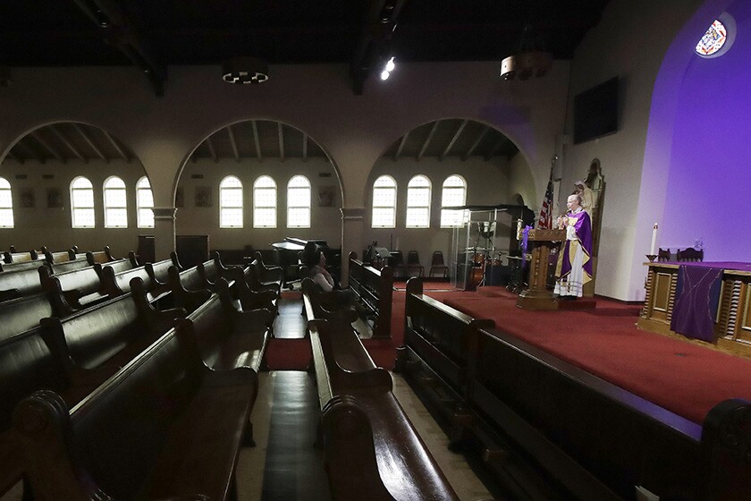 The Rev. Roger Gustafson is recorded celebrating Mass in an empty St. Brendan the Navigator Catholic Church in San Francisco.