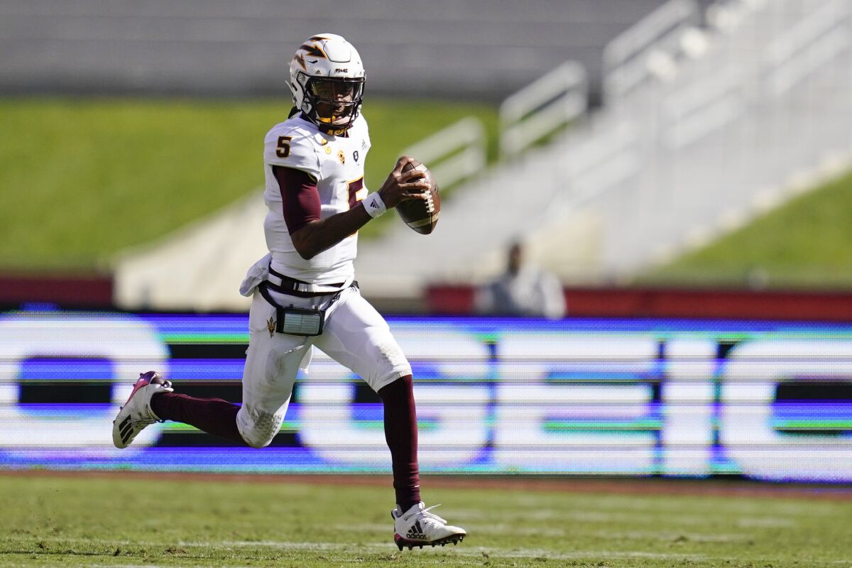 Arizona State quarterback Jayden Daniels runs the ball during the second half against USC.