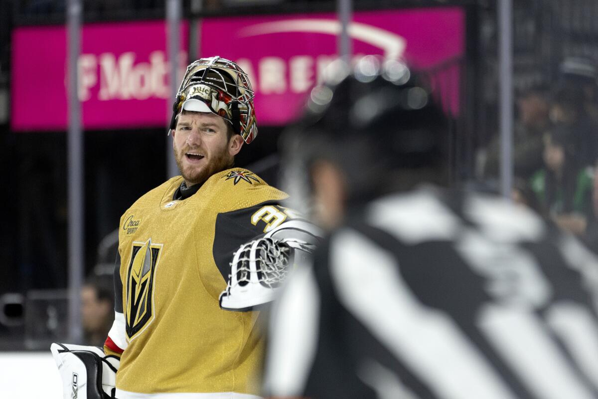 Vegas Golden Knights goaltender Jonathan Quick speaks to a referee.