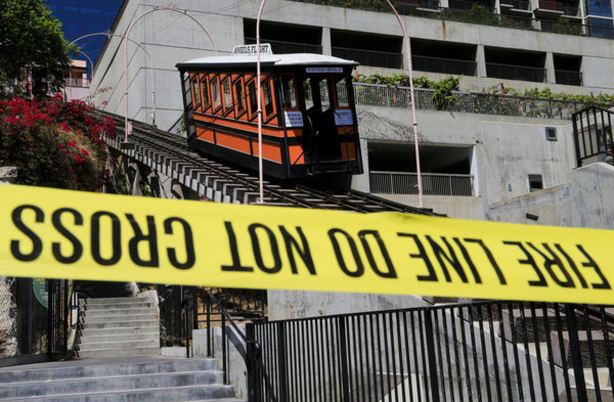 Caution tape reminds the public to stay away from the closed Angels Flight after rail car Sinai jumped the tracks last week.