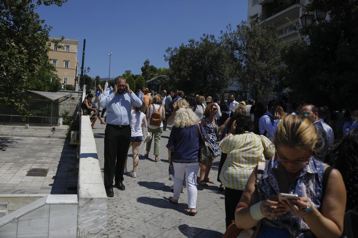 Workers were evacuated from office buildings after a strong earthquake hit near the Greek capital of Athens on Friday.