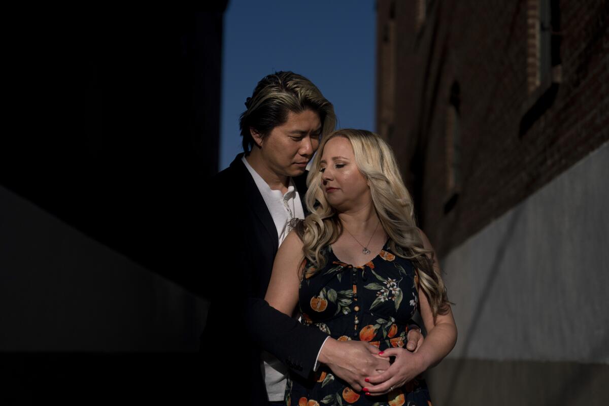 Jessica Tincopa stands with her husband, Rob Tran.
