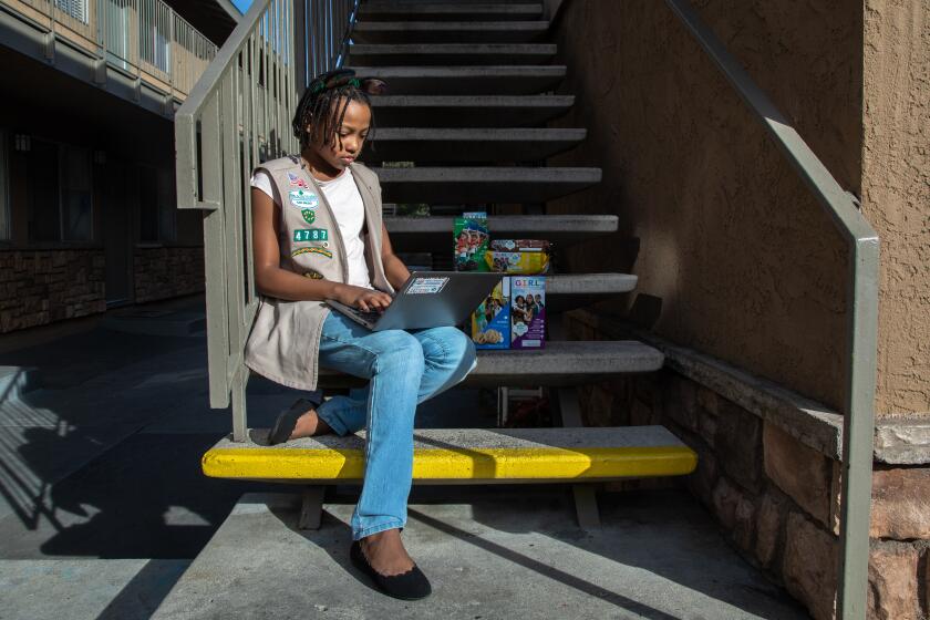 SAN DIEGO, CA - FEBRUARY 02: Girl Scout, Danity Valentine, 11, of City Heights has had to find creative ways to sell cookies this season in San Diego, CA. (Jarrod Valliere / The San Diego Union-Tribune)