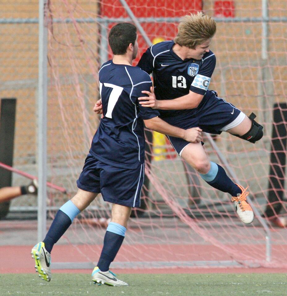 CV's Matt Ryan celebrates a goal with teammate Chris Sinani during a match at Glendale High on Tuesday, January 28, 2014.