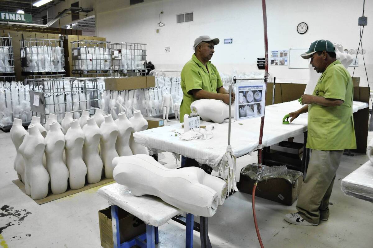 Workers produce mannequins at the Tecma Group, which operates 18 maquiladoras for 33 companies in the northern border city of Ciudad Juarez, Mexico. The maquiladora industry and other business groups say they will mount legal challenges to Mexico's newly passed tax laws, which raise levies on everything from border industries to junk food.